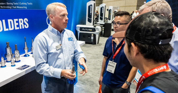 Jack Burley, President/COO, demonstrating the simplicity of tool adjustment of the hydraulic chuck at IMTS.