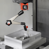 A dial indicator measuring a workpiece.